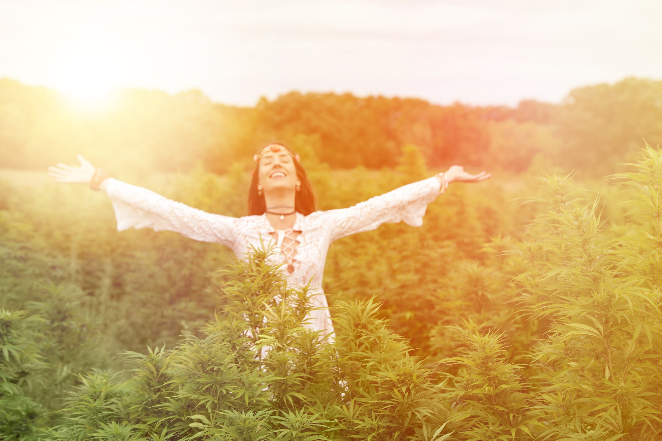 Young woman enjoying cannabis field