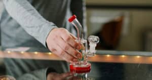 A budtender works inside of a retail cannabis shop in Oregon.
