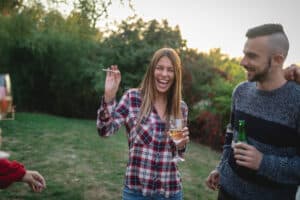 Young group of people having fun together, having a party and a gathering, celebrating a birthday.