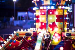 Close-up of old amusement park lights on black background. Retro taste.